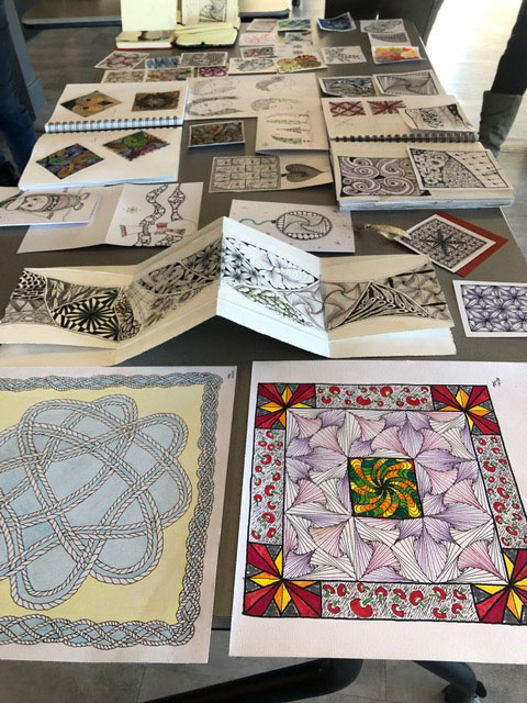 Table with several Zentangle drawings