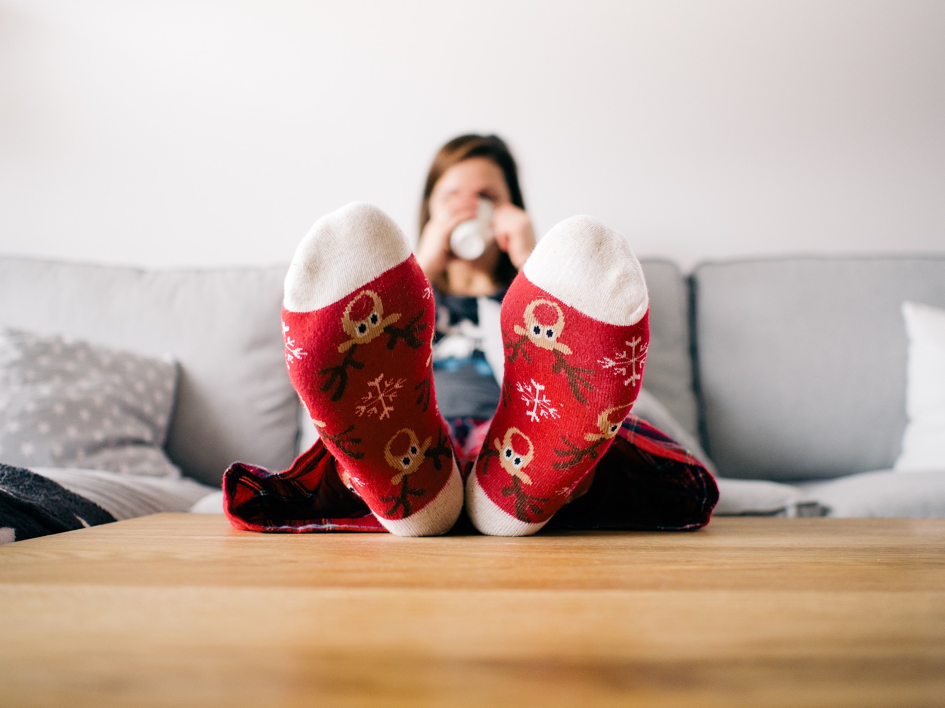 Christmas socks, relaxing on sofa